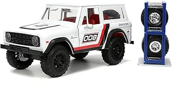 Just Trucks 1:24 1973 Ford Bronco Bridgestone Die-Cast Truck & Tire Rack, Toys for Kids and Adults(White/Red)