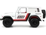 1973 Ford Bronco #008 White with Red and Black Stripes and Red Interior with Extra Wheels "Just Trucks" Series 1/24 Diecast Model Car by Jada